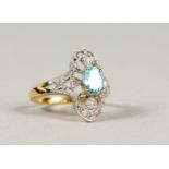 A 9CT GOLD, OVAL BLUE TOPAZ AND DIAMOND FILIGREE RING.