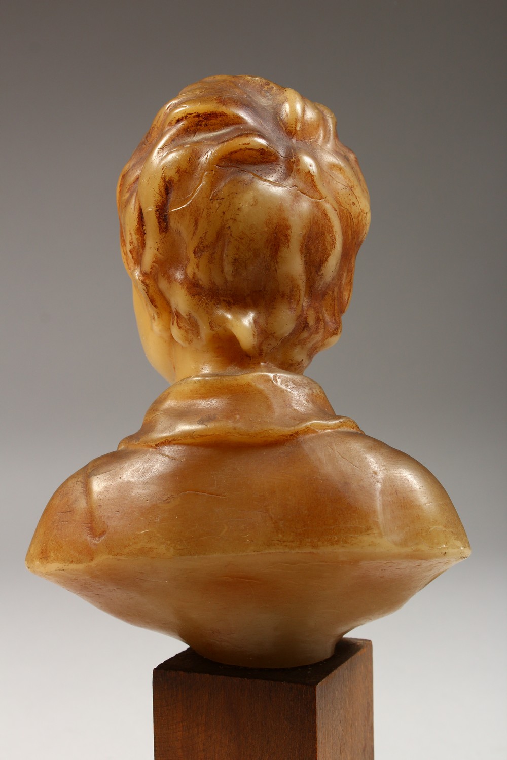 A SMALL GEORGIAN CARVED WAX BUST, head and shoulders of a young boy. 6ins high on a wooden plinth. - Image 6 of 8