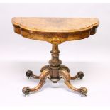 A GOOD VICTORIAN FIGURED WALNUT AND MARQUETRY CARD TABLE, of shaped demi-lune form, the turned and