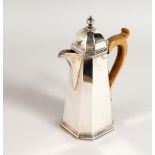 A TAPERING COFFEE POT with wooden handle. London 1908.