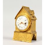 A GOOD MINIATURE GILT METAL CLOCK with verge movement. 3.25ins high.