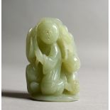A CHINESE JADE CARVING OF TWO BOYS. 2.5ins high.