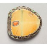 A LARGE SILVER MOUNTED JADE BUCKLE. 3.25ins.