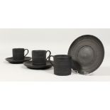 A SET OF THREE WEDGWOOD BLACK BASALT BAMBOO PATTERN COFFEE CANS AND SAUCERS. Impressed WEDGWOOD