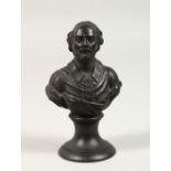 A TINY BLACK BASALT BUST. Impressed WEDGWOOD. 4ins high.