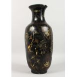 A CHINESE BLACK LACQUER PAPIER MACHE VASE, decorated with figures in a landscape. 17.5ins high.