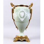 A GOOD 19TH CENTURY FRENCH PATE-SUR-PATE TWO-HANDLED URN, with ormolu mount inset with a portrait.