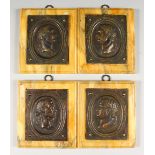 A GOOD SET OF FOUR MARBLE AND BRONZE PLAQUES of EMPERORS. 6ins x 5ins.