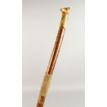 A WALKING STICK, the handle carved as a fox. 51ins long.
