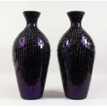 A PAIR OF STAINED GLASS STYLE PURPLE GLASS VASES. 1ft 9ins high.