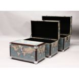 A SET OF THREE TRUNKS, covered with maps of the world. Largest: 27ins wide.