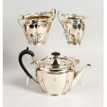 A 1920'S SILVER THREE PIECE TEA SET, including teapot, sugar basin and milk jug. Sheffield 1920.