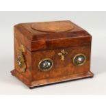 A GOOD VICTORIAN FIGURED WALNUT STATIONERY CASKET, the pair of gilded carrying handles inset with