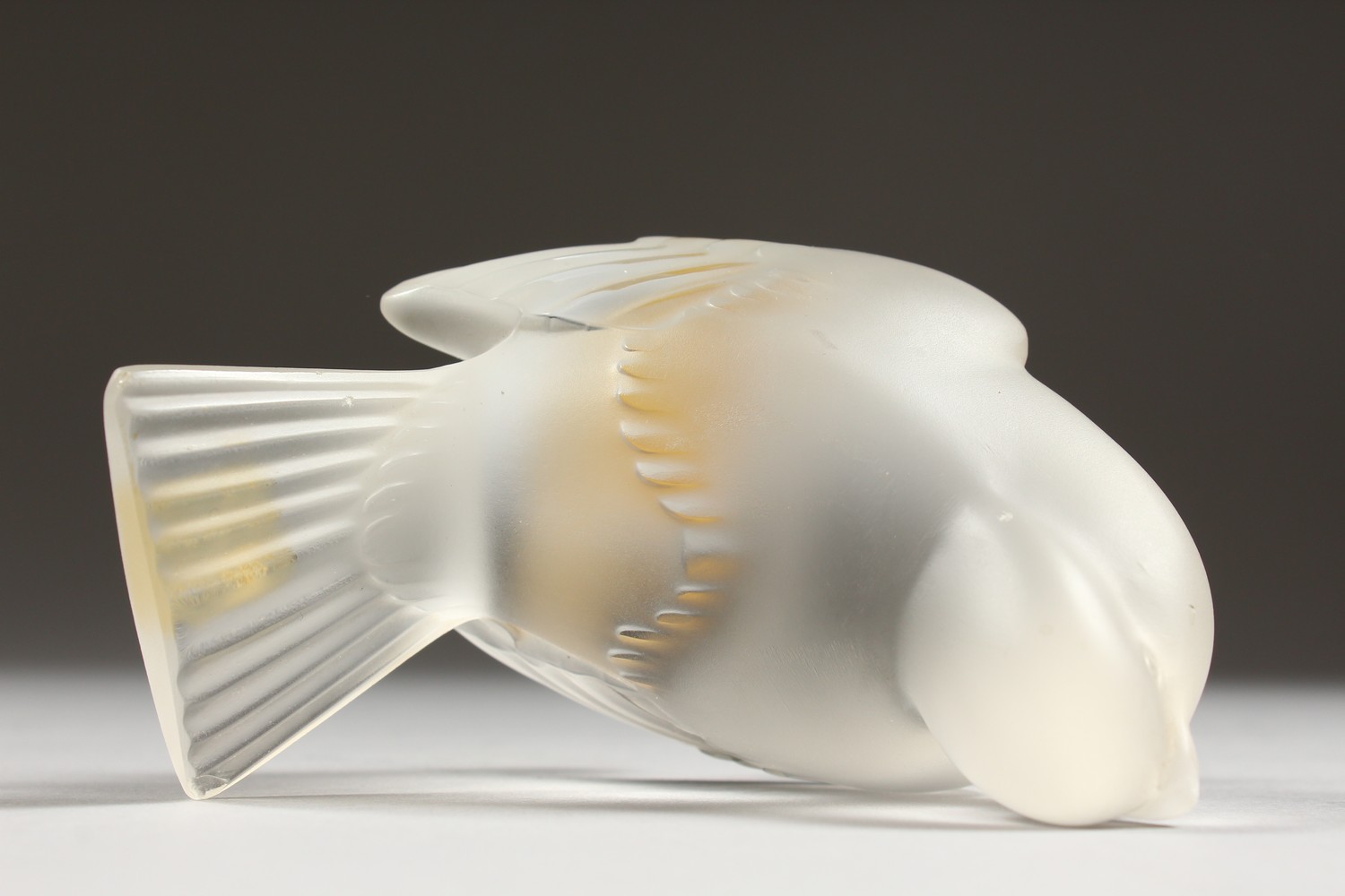 A LALIQUE FROSTED GLASS MODEL OF A BIRD, seated with folded wings, (small tail chip). 4ins long. - Image 6 of 8
