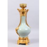 A GOOD 19TH CENTURY FRENCH PORCELAIN ORMOLU MOUNTED TWO-HANDLED URN SHAPED LAMP. 17ins high.