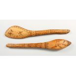TWO CARVED WOOD ABORIGINAL CLUBS. 19.5ins long.