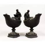 A PAIR OF WEDGWOOD BLACK BASALT VESTAL OIL LAMPS, one with a female figure with a ewer, the other