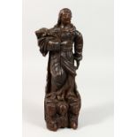 AN EARLY CARVED SOFT WOOD GROUP OF THE ASCENSION. 14.5ins high.