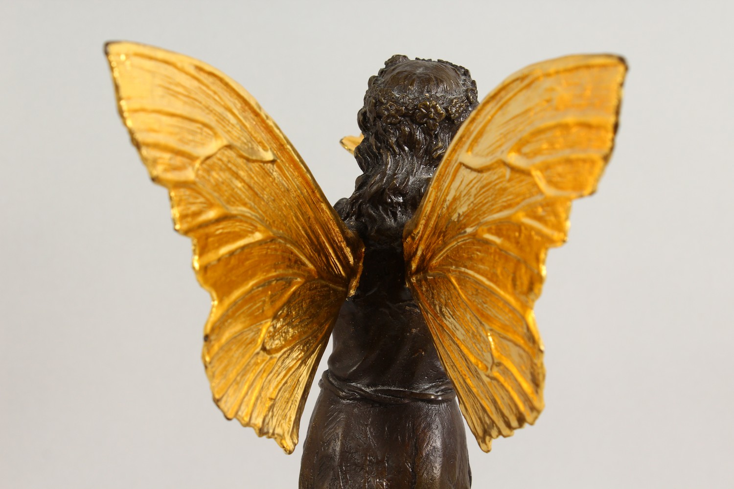 A BRONZE FIGURE OF A FAIRY, 20TH CENTURY, standing holding a shell in her hands, on a marble base. - Image 6 of 9