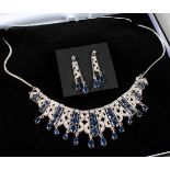 A SILVER SAPPHIRE SET NECKLACE AND EARRINGS.