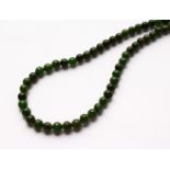 A JADE BEAD NECKLACE.