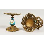 A PAIR OF ORMOLU AND SEVRES STYLE PORCELAIN SMALL TAZZAS. 5ins high.