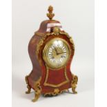 A 19TH CENTURY FRENCH TORTOISESHELL AND ORMOLU MANTLE CLOCK. 14.5ins high.