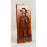 A 19TH CENTURY DOUBLE SIDED ELM GINGERBREAD MOULD, carved with a man and a woman. 18.5ins x 7.5ins.