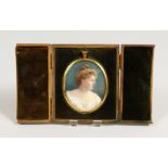 A GOOD EARLY 20TH CENTURY OVAL PORTRAIT MINIATURE OF A LADY WEARING A WHITE DRESS, believed to be