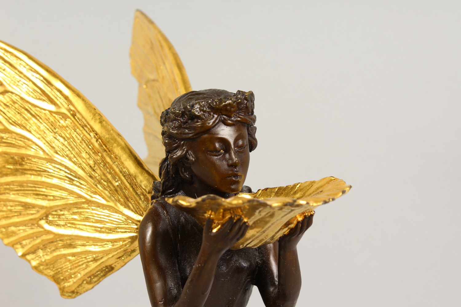 A BRONZE FIGURE OF A FAIRY, 20TH CENTURY, standing holding a shell in her hands, on a marble base. - Image 2 of 9