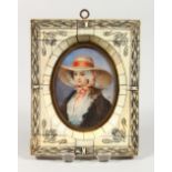 A LATE 19TH CENTURY OVAL PORTRAIT MINIATURE of a young lady wearing a broad brimmed hat, in an ivory
