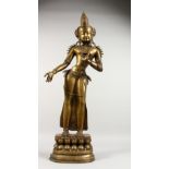 A LARGE BRONZE THAI BUDDHA, standing on a lotus pad. 34ins high.