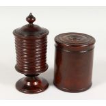 A GOOD TURNED MAHOGANY PEDESTAL JAR AND COVER, along with a turned wood box and cover.