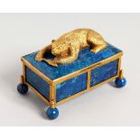 A SUPERB RUSSIAN LAPIZ BOX AND COVER, the lid with a bear holding a fish, supported on four ball