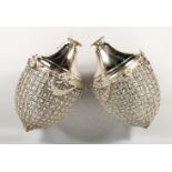 A PAIR OF LARGE, SILVER PLATED PINEAPPLE SHAPED CHANDELIERS. 24ins high.