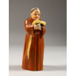 A ROYAL WORCESTER MONK CANDLE SNUFFER. 4.75ins high.