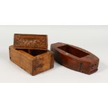 TWO WOODEN BUTTER MOULDS, each with carved bases. 7.5ins x 10.5ins long.