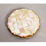 A LADIES STRATTON MOTHER-OF-PEARL COMPACT in original box.