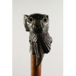 A CAST METAL DOG'S HEAD AND PHEASANT WALKING STICK. 2ft 9ins long.