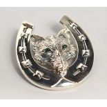 A LARGE SILVER HORSHOE AND FOX BROOCH.