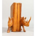 A PAIR OF WOODEN BOOKENDS, carved with rhinos. 8ins high.