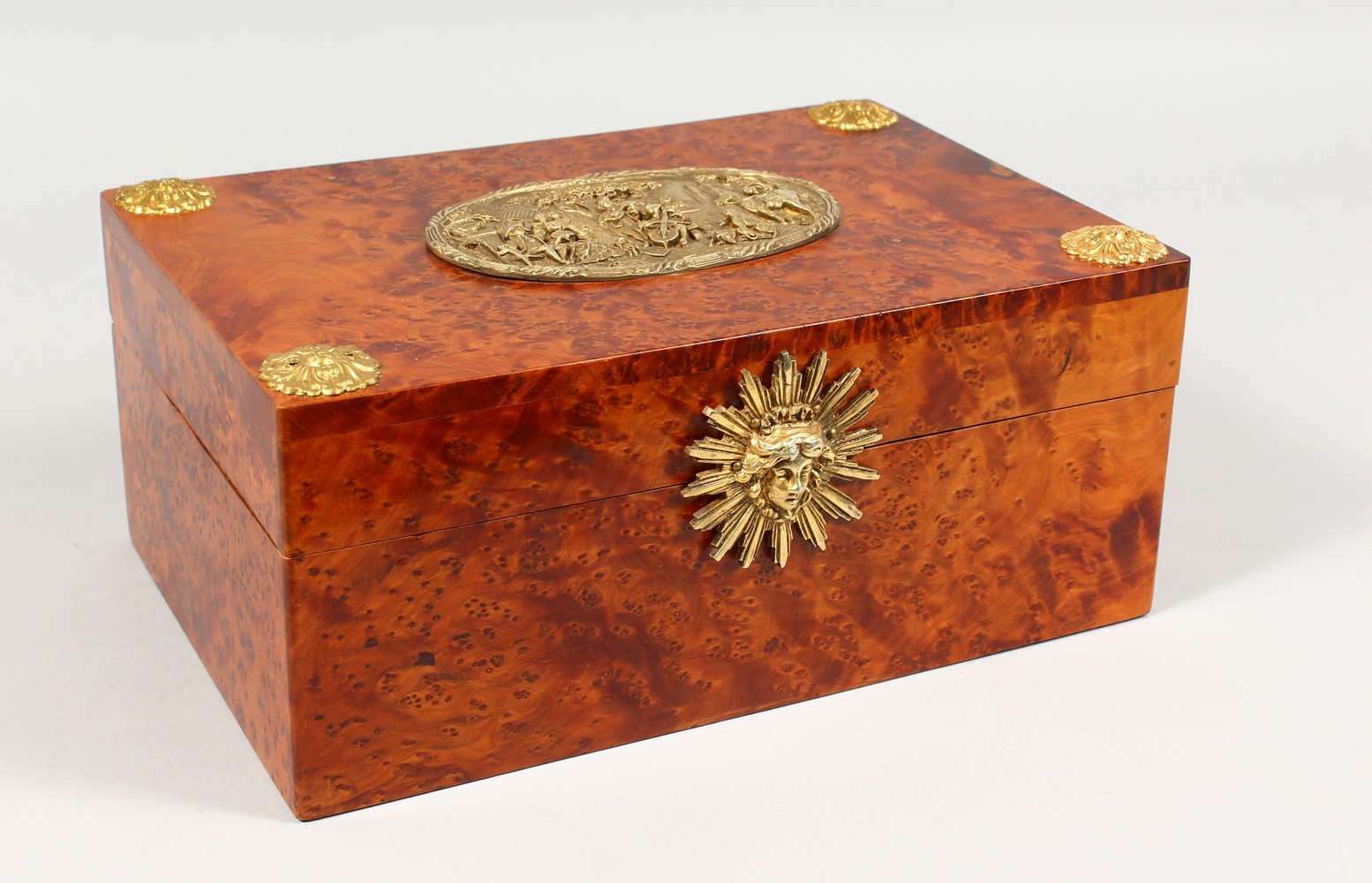 A 19TH CENTURY THUYA WOOD CASKET, with brass mounts and silk interior. 11.5ins long.