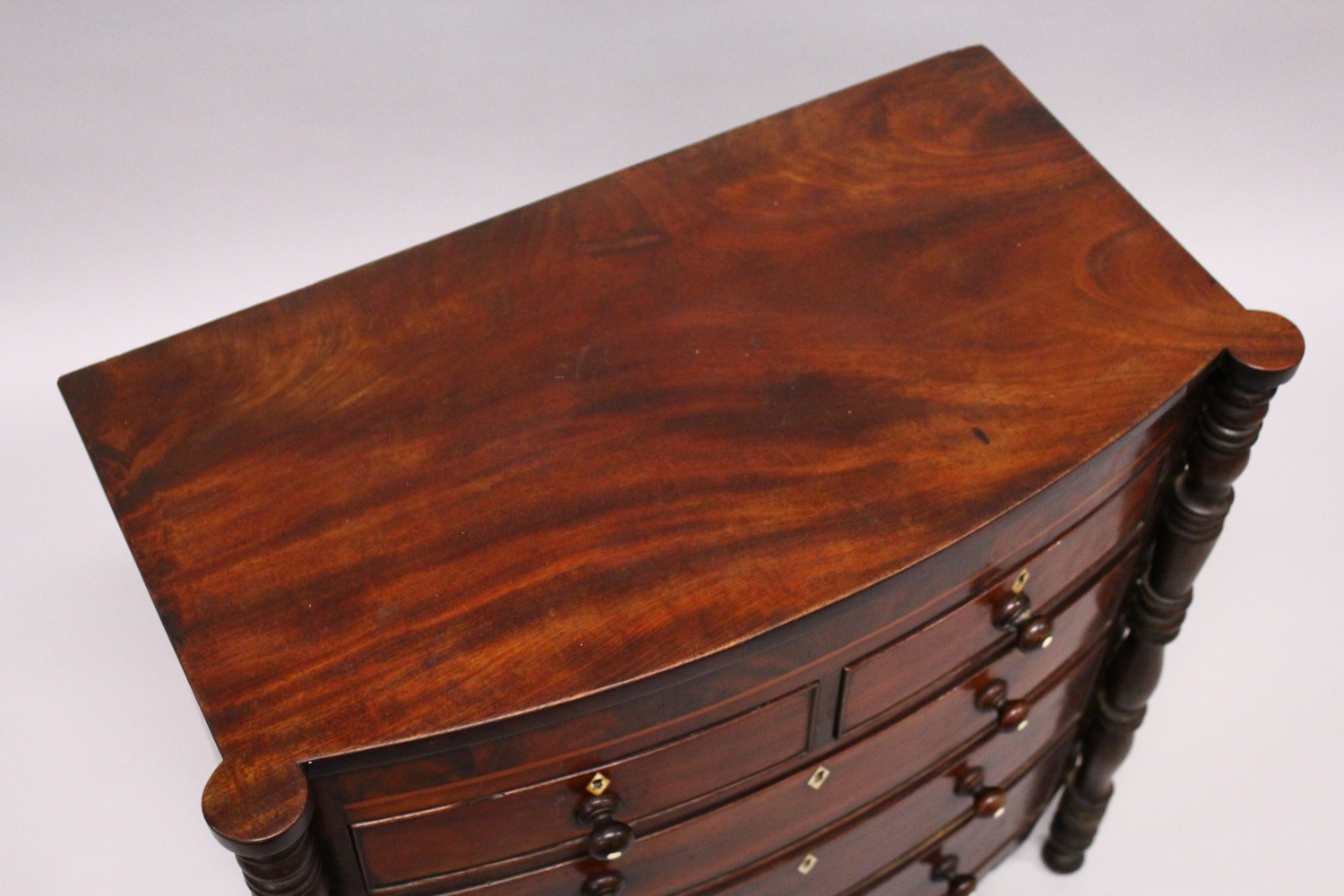 AN EARLY 19TH CENTURY MAHOGANY MINIATURE BOWFRONT CHEST, with two short and three long graduated - Image 5 of 8