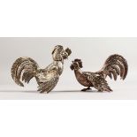 A PAIR OF CONTINENTAL COCKEREL TABLE ORNAMENTS. 6.5ins long.