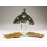 THREE BYZANTINE COMBS, one with a stand. 2.5ins and 3.75ins wide.