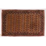 A GOOD KASHAN RUG first half 20th Century, beige ground with seven rows of seven stylized palmettes,