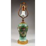 A CHINESE FAMILLE VERTE BALUSTER SHAPED VASE, with ormolu mounts, as a lamp. 17ins high.