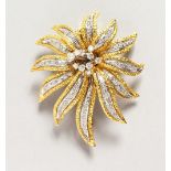 A GOOD 18CT GOLD AND DIAMOND SET FLOWER HEAD BROOCH. 2.25ins long.