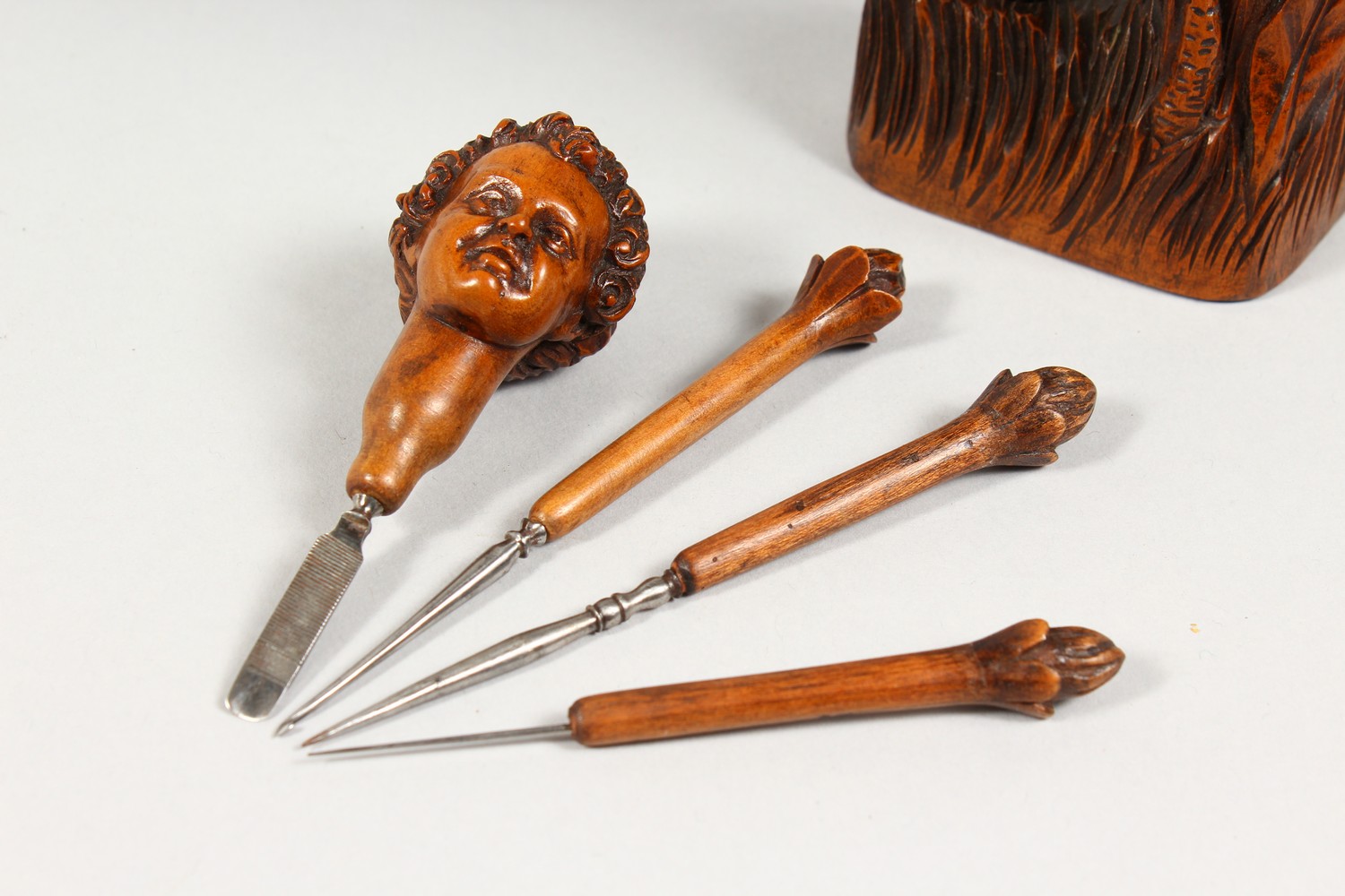 A GOOD SMALL CARVED FRUITWOOD MANICURE SET, as a figure of a boy standing next to a group of trees - Image 4 of 9