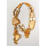 A GOOD LARGE NECKLACE, with Roman stone and terracotta busts mounted in a contemporary gilt metal